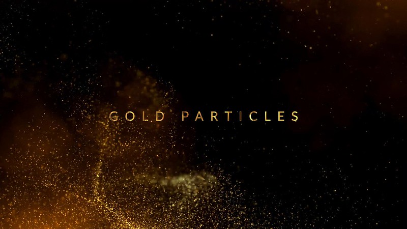 4K golden particles swirls on the black background with bokeh and starglow glitter video