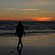 Girl is Walking on the Beach at Sunset - VideoHive Item for Sale